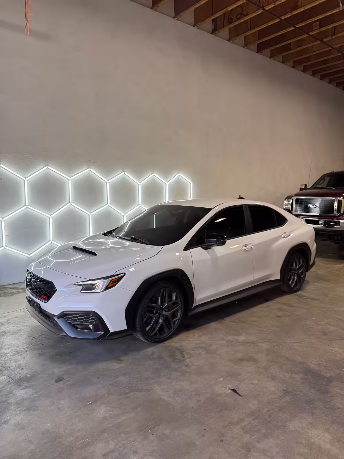 White Subaru WRX with professionally tinted windows