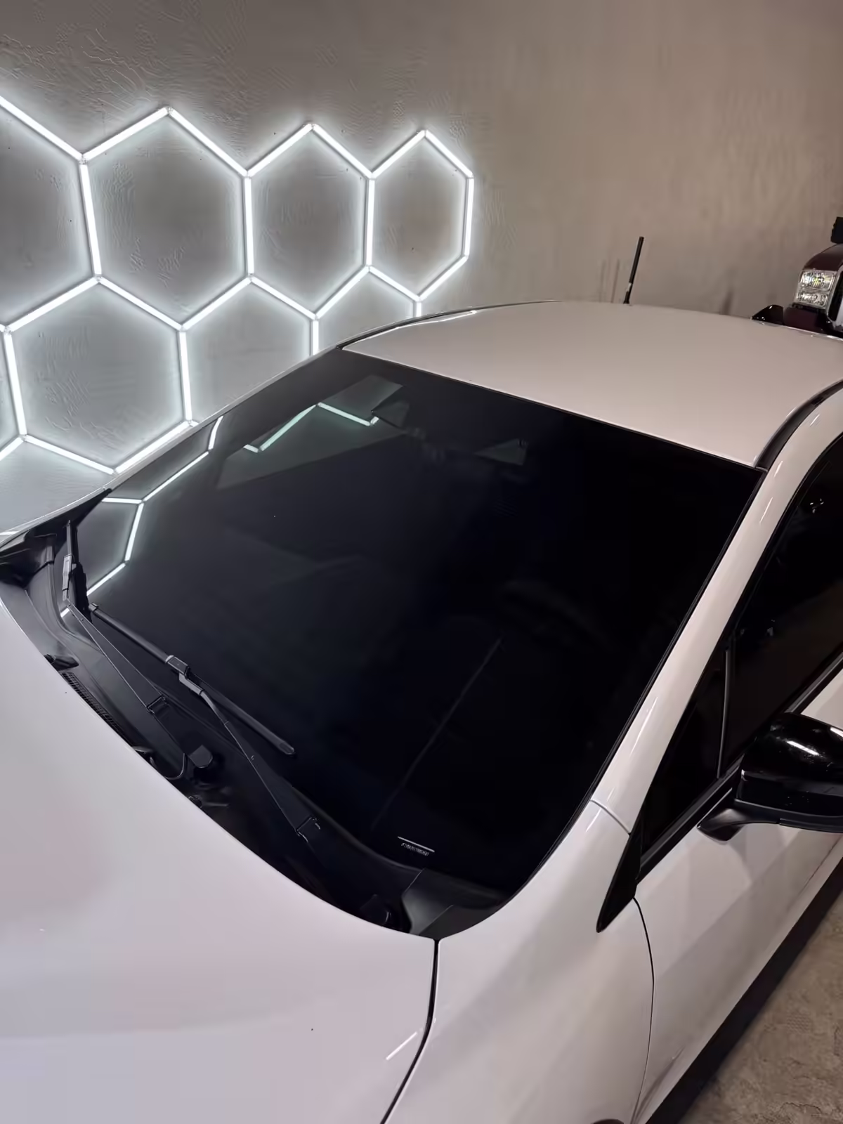 Ceramic windshield tint on a white car