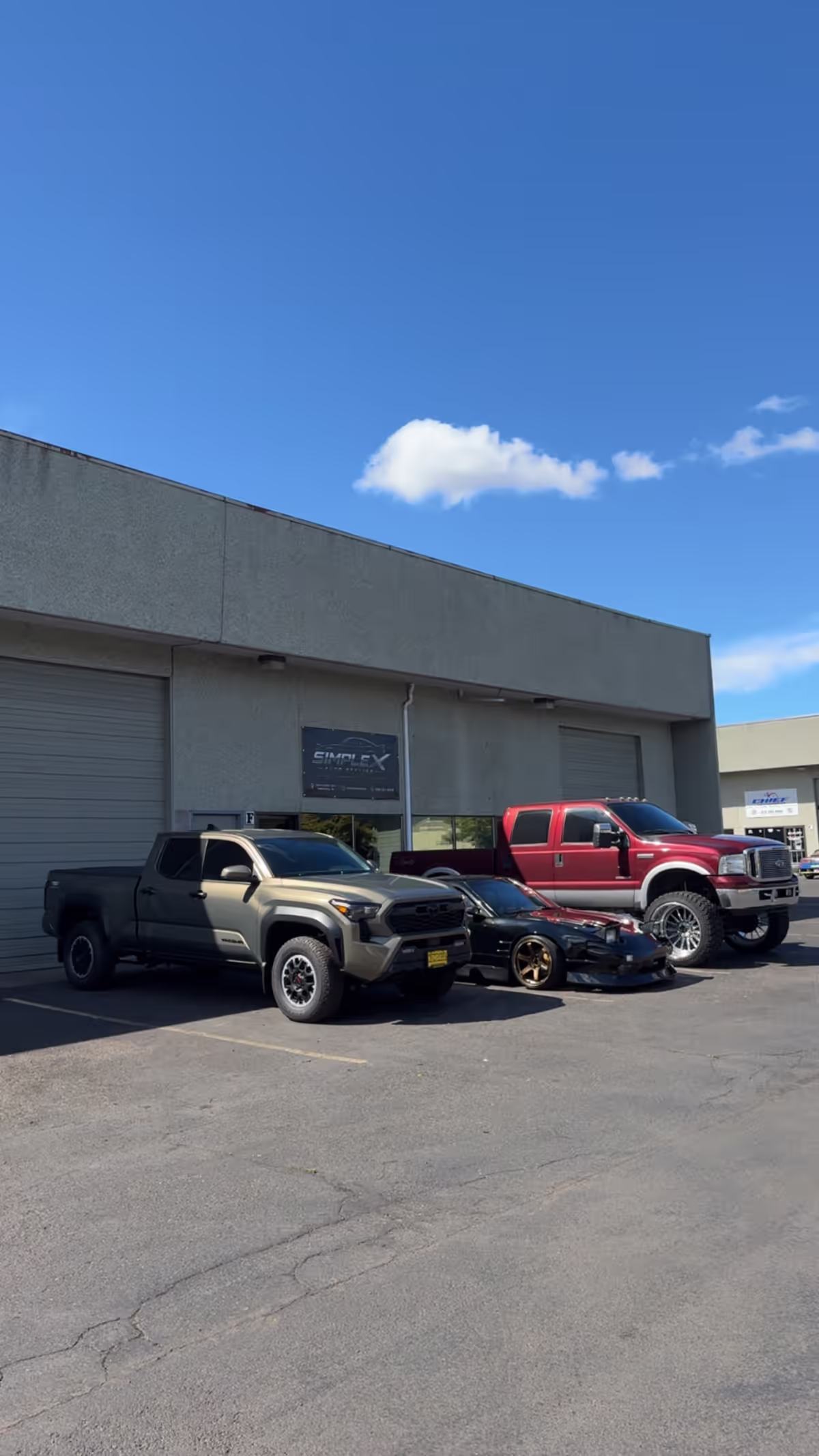 Vehicles outside the Simplex Auto Styling shop in Springfield